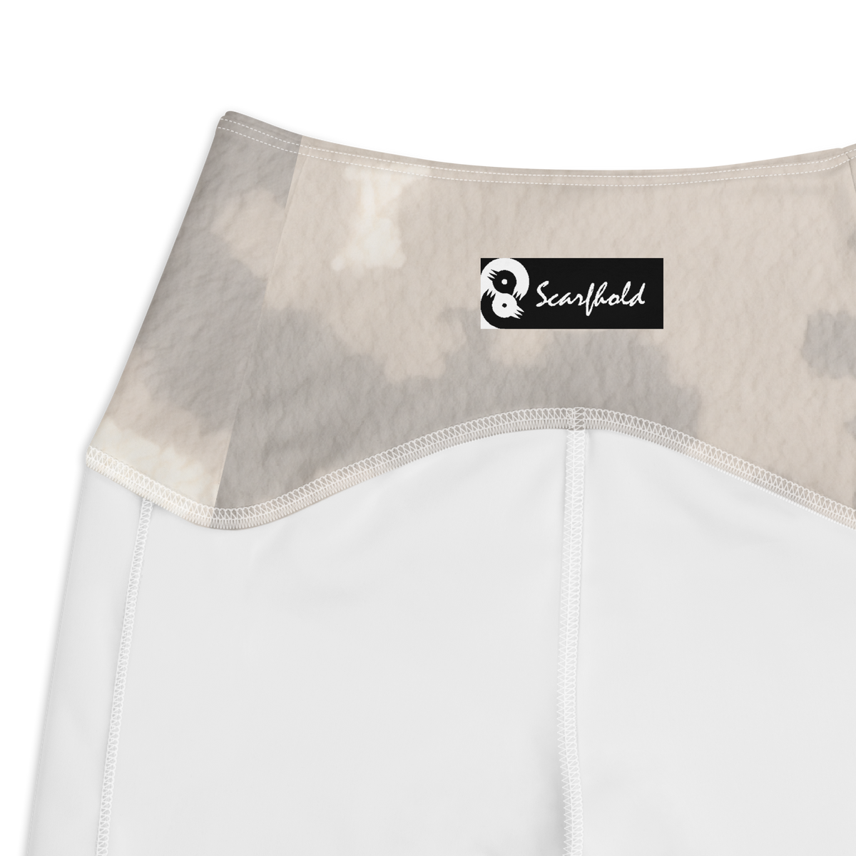 Caspra Beige camouflage high-waisted pocket leggings, inside-label and construction detail.