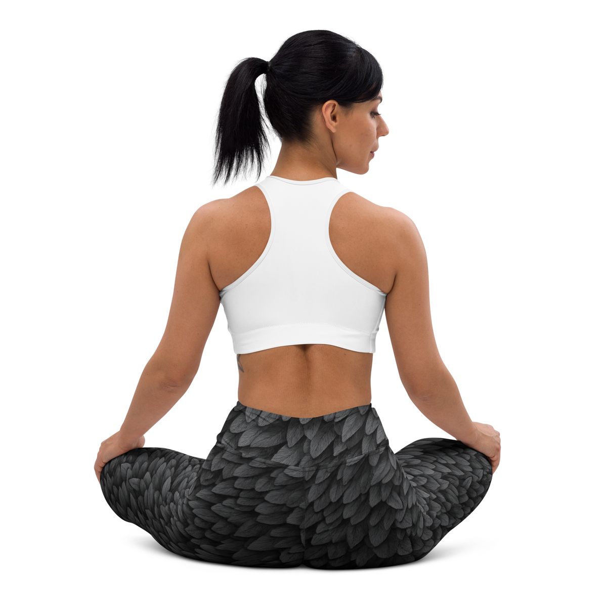 Corvid Greyscale high-waisted yoga leggings, seated back view.