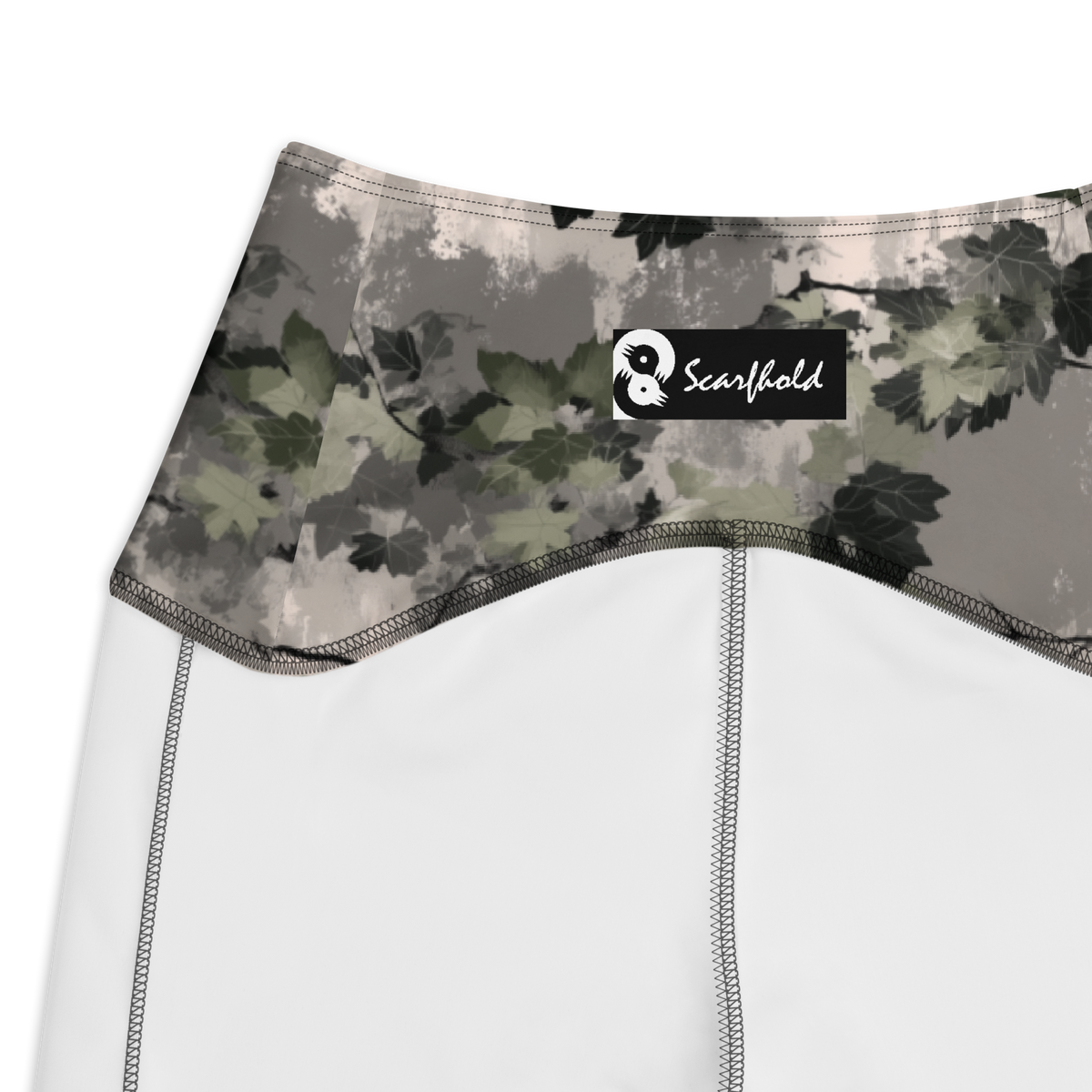 Detrita Original camouflage high-waisted pocket leggings, inside-label and construction detail.