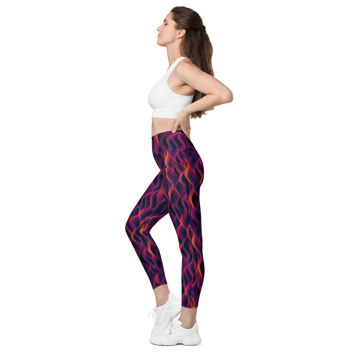 Inferna Purple high-waisted pocket leggings, pocket-in-use view.