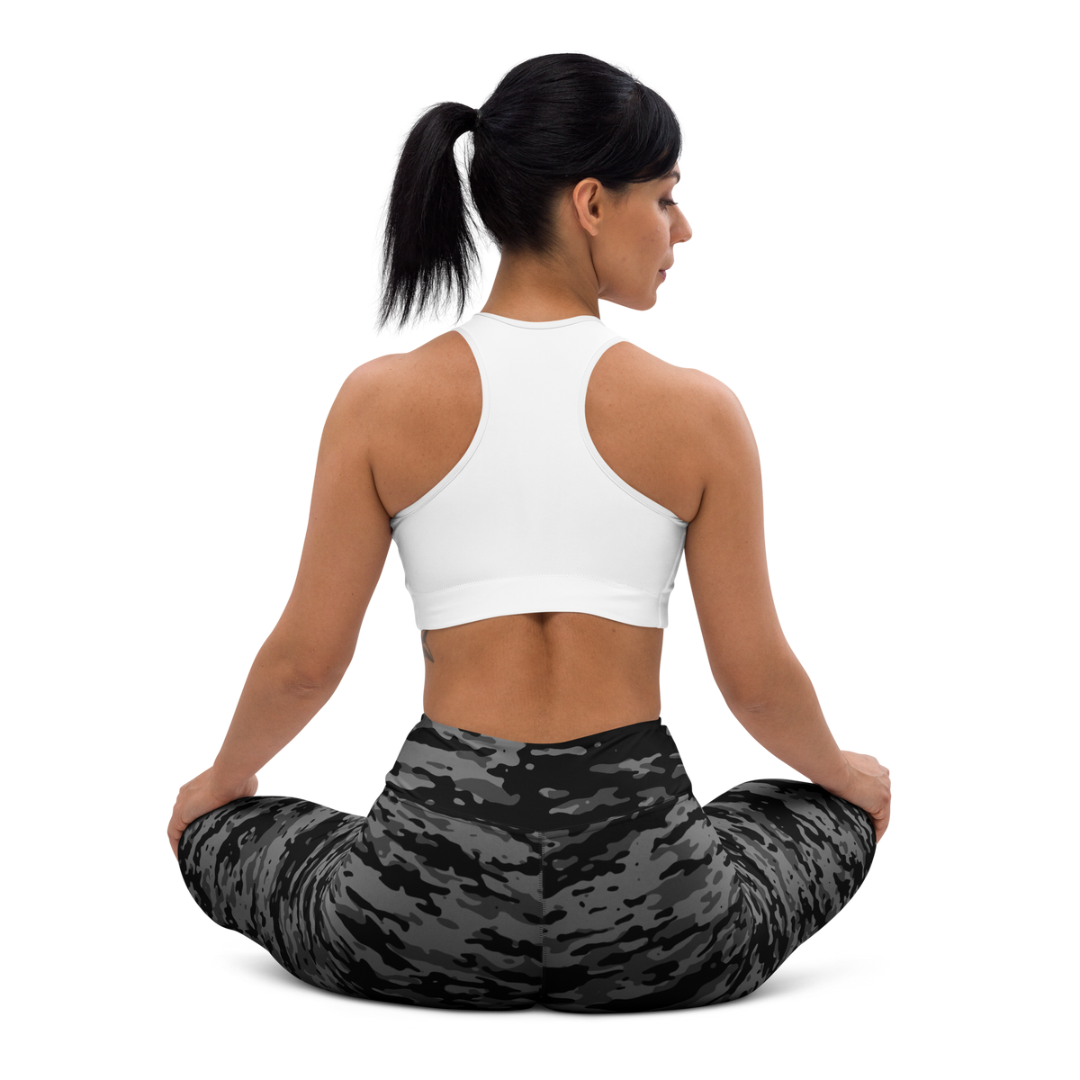 Inka Greyscale camouflage high-waisted yoga leggings, seated back view.