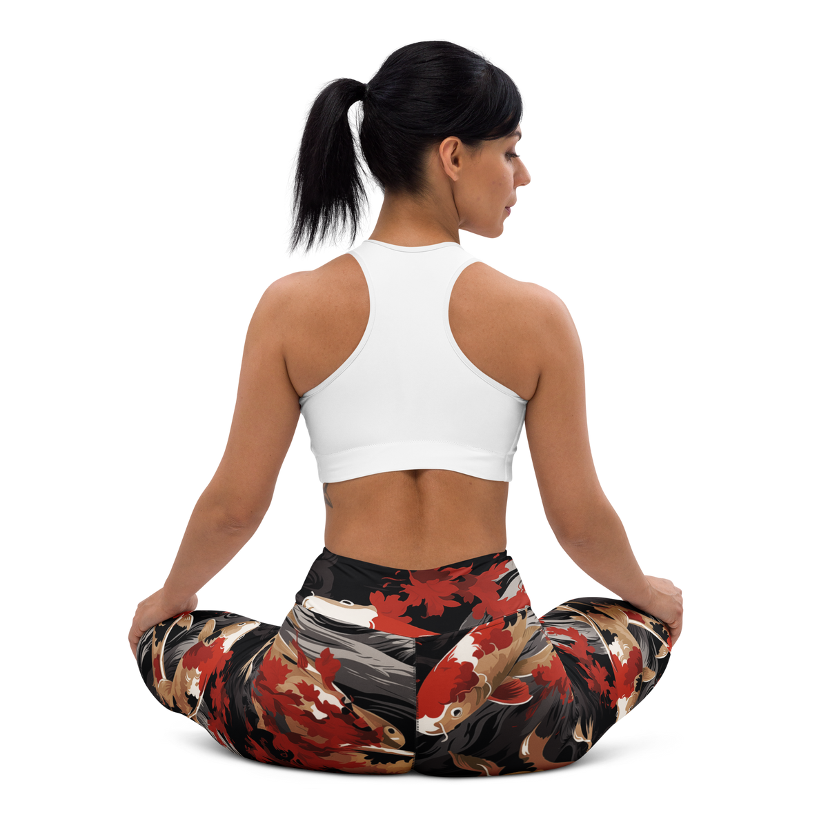 Koi Scarfhold Palette high-waisted yoga leggings, seated back view.