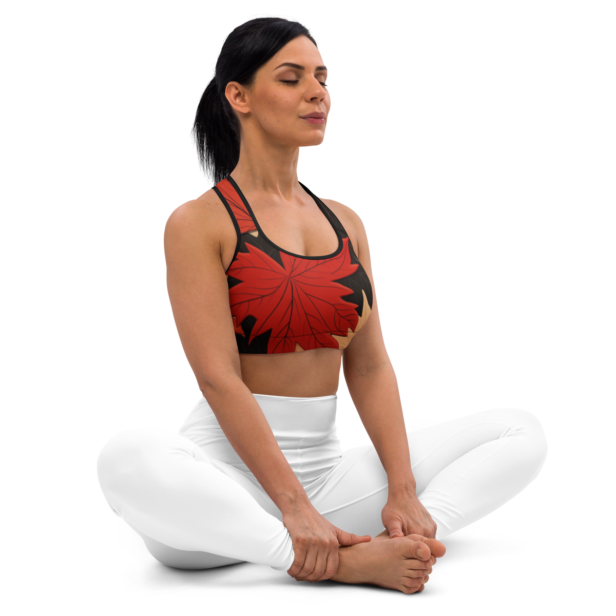Seated front view of the Maple Scarfhold Palette medium-support padded sports bra with maple leaf
