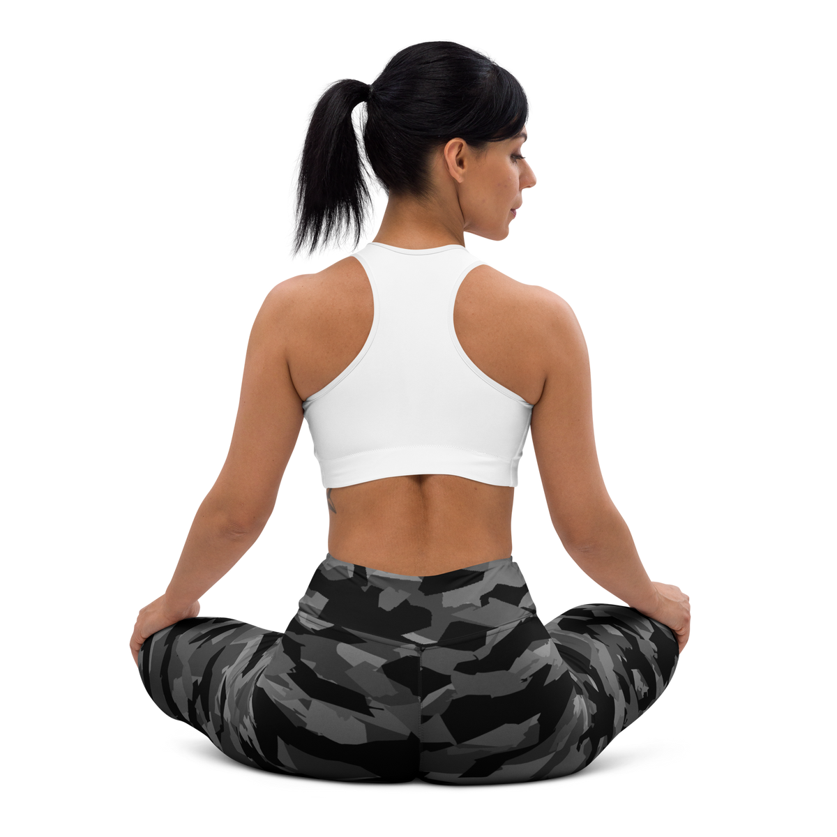 Mica Greyscale camouflage high-waisted yoga leggings, seated back view.
