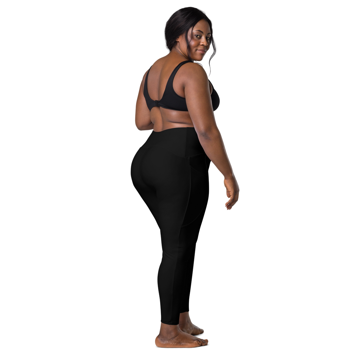 Plain Black high-waisted pocket leggings, larger-model back view.