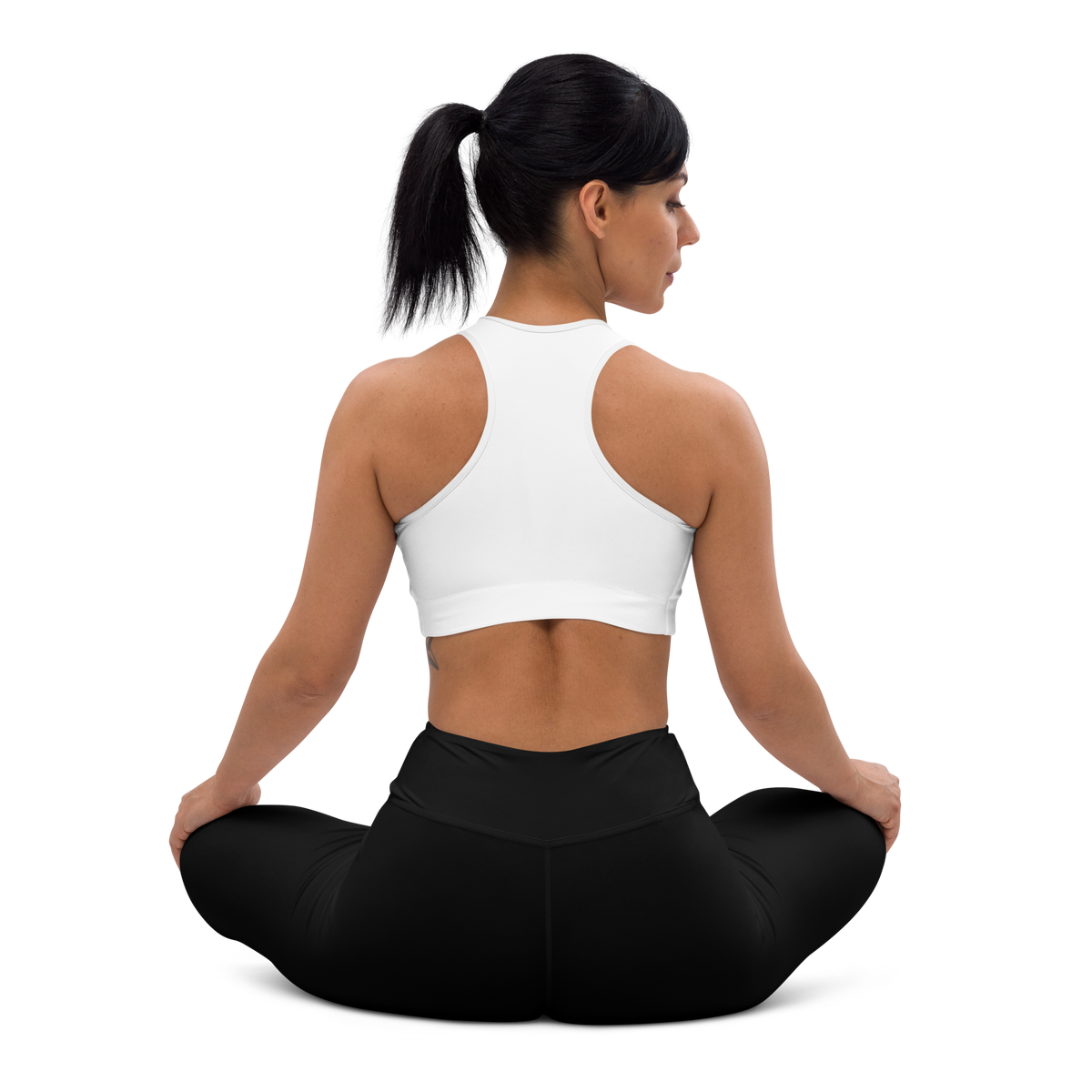 Plain Black high-waisted yoga leggings, seated back view.