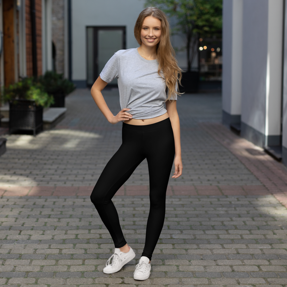Plain Black mid-rise comfort leggings, lifestyle front view.