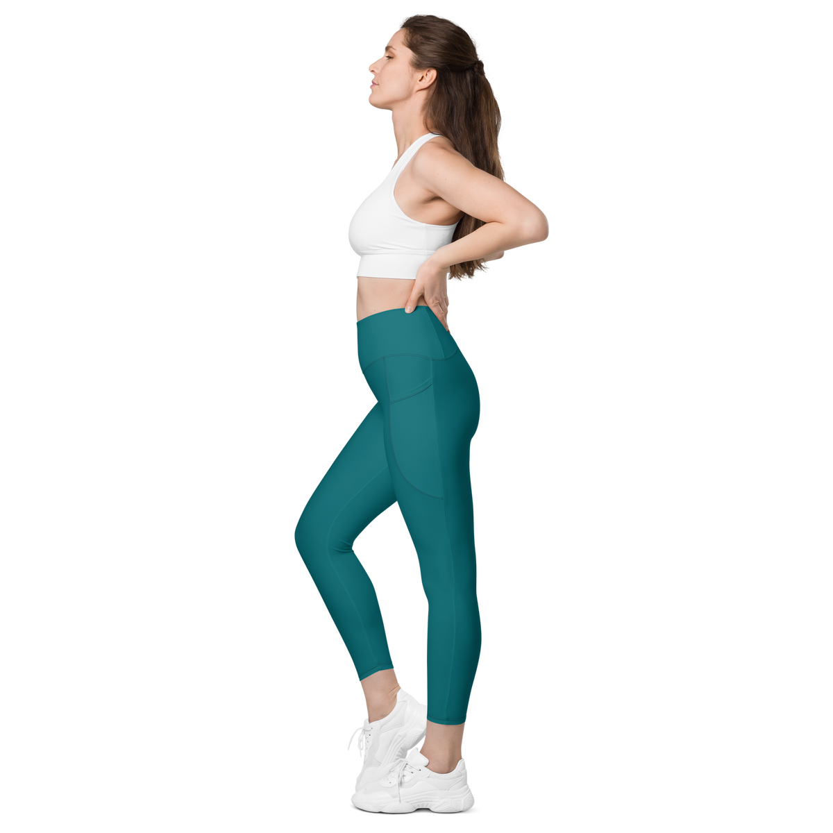 Plain Harbour Blue high-waisted pocket leggings, pocket-in-use view.