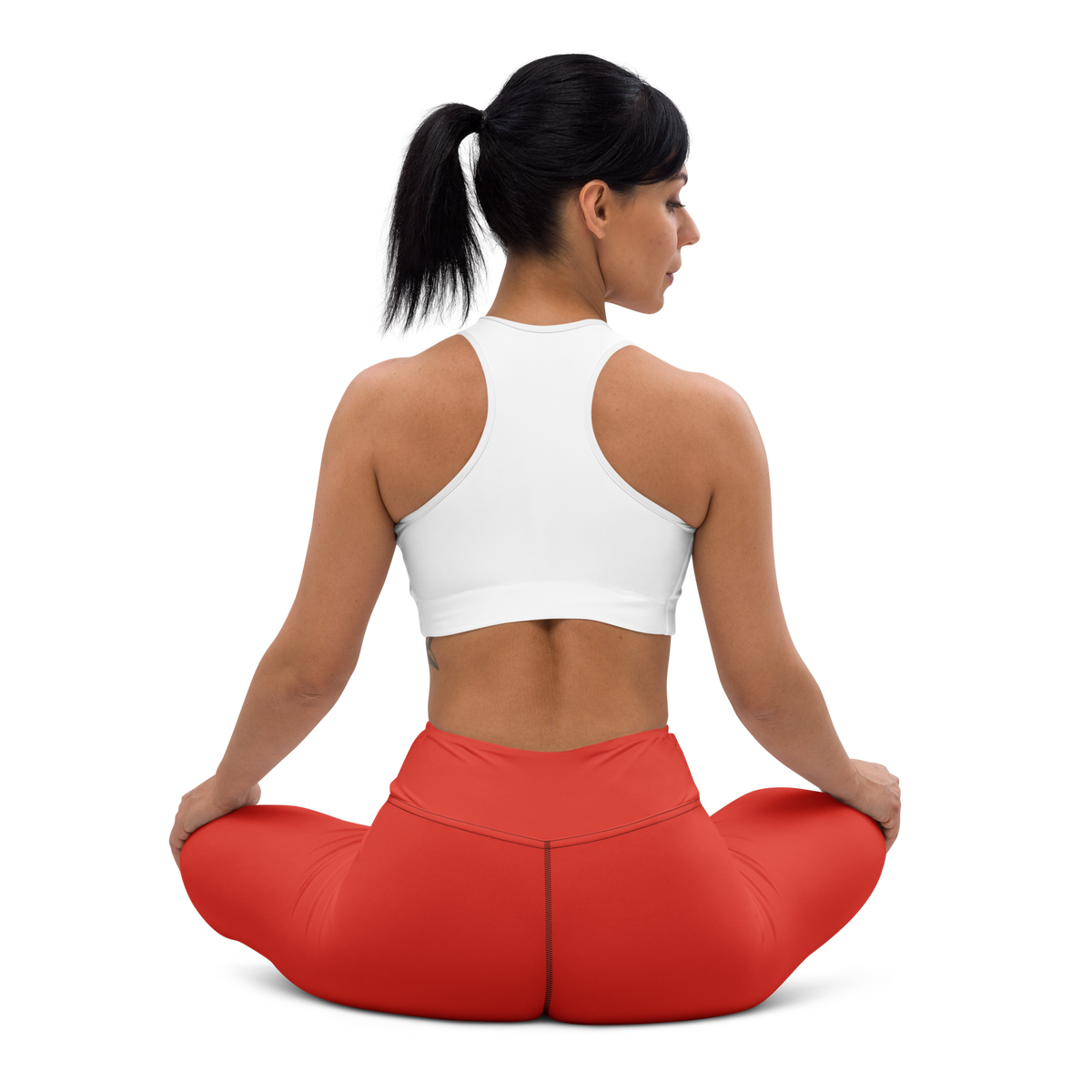 Plain Poinciana high-waisted yoga leggings, seated back view.