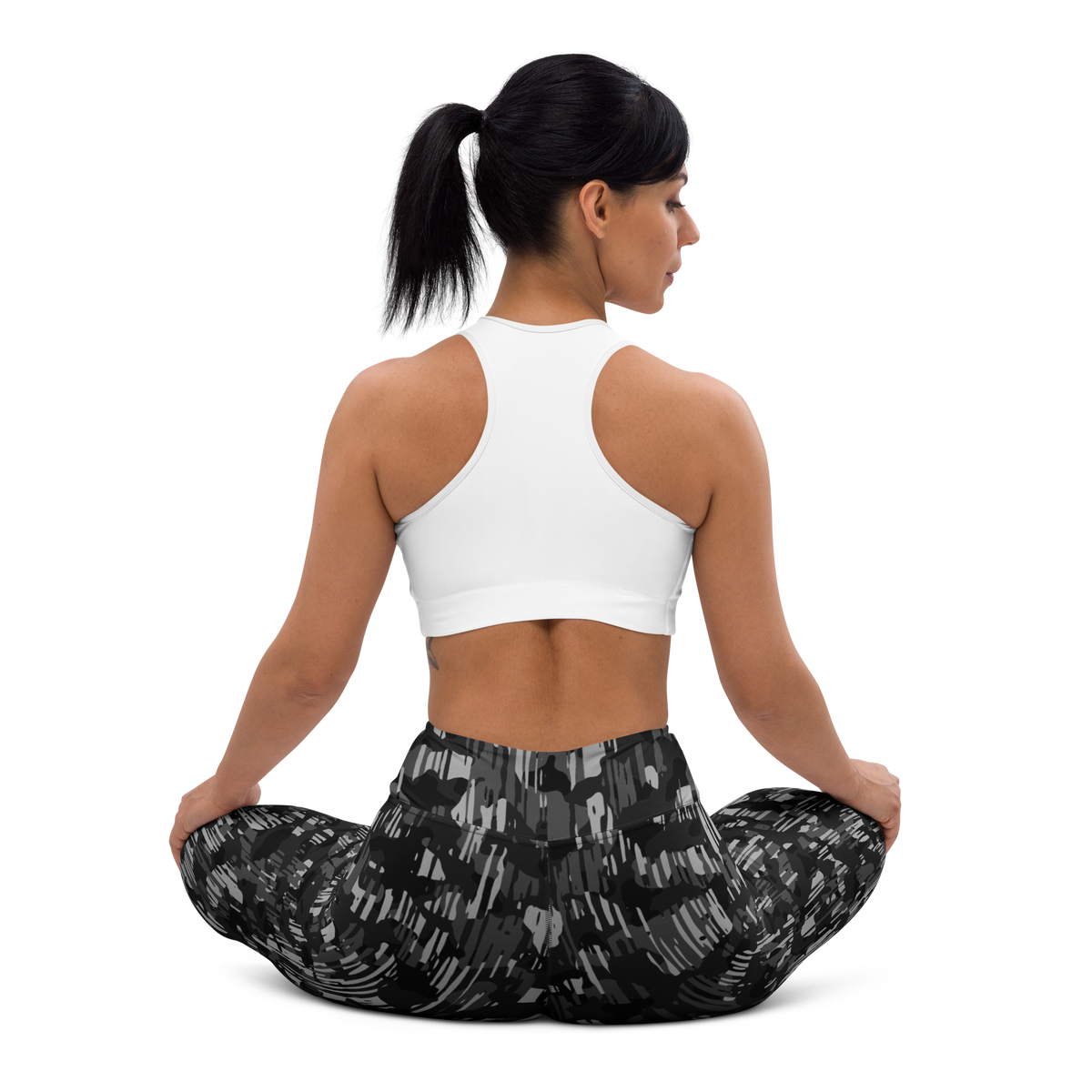 Savannah Black high-waisted yoga leggings, seated back view.