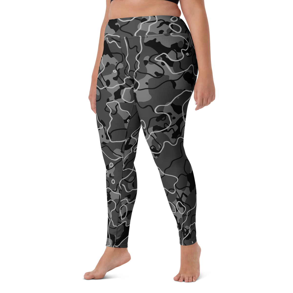 Tundra Greyscale camouflage high-waisted yoga leggings, larger-model left-front view.