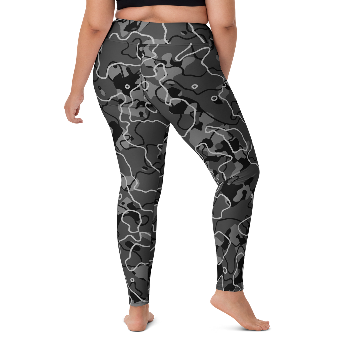 Tundra Greyscale camouflage high-waisted yoga leggings, larger-model right-back view.
