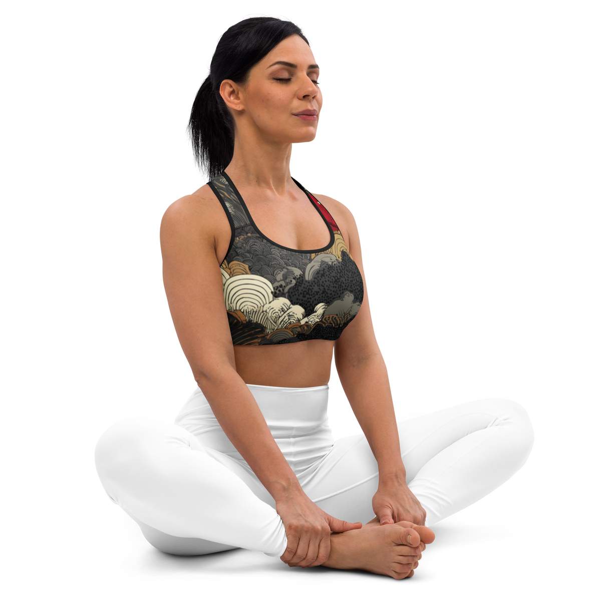 Seated front view of the Yūkoku Scarfhold Palette medium-support padded sports bra with storm clouds